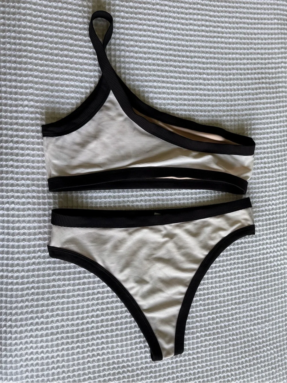 White one shoulder bikini with black lining